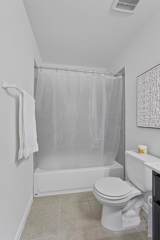 full bathroom featuring toilet, vanity, tile patterned flooring, and shower / bath combination with curtain