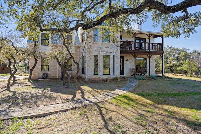 view of front of house with a front lawn and a wooden deck