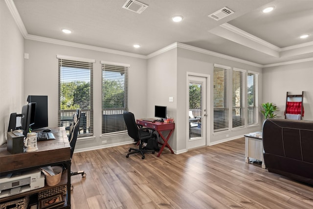 home office featuring light wood finished floors, recessed lighting, visible vents, and ornamental molding