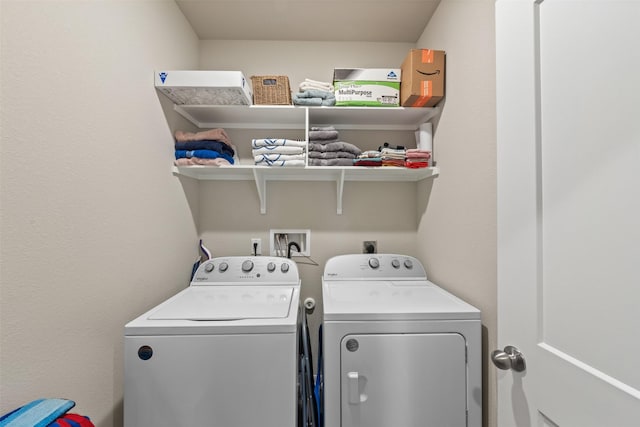 clothes washing area with laundry area and washing machine and clothes dryer