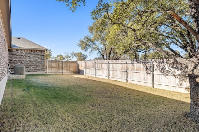 view of yard with cooling unit and a fenced backyard