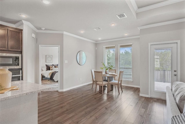 1207 Haley Ln, Salado, TX 76571 - dining area featuring dark wood finished floors, ornamental molding, and recessed lighting