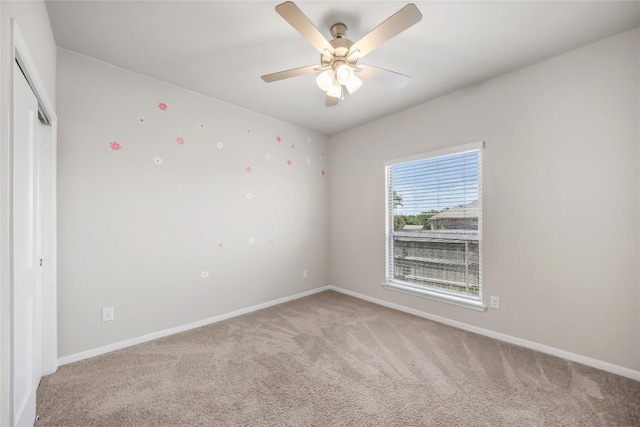 1207 Haley Ln, Salado, TX 76571 - empty room featuring light carpet and a ceiling fan