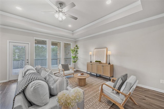 1207 Haley Ln, Salado, TX 76571 - living area with healthy amount of natural light, a raised ceiling, wood finished floors, crown molding, and ceiling fan