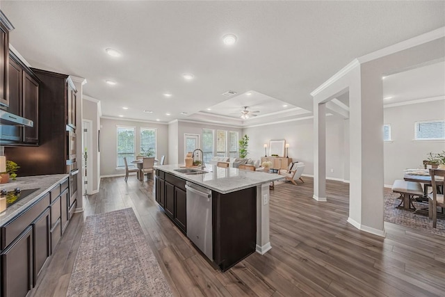 1207 Haley Ln, Salado, TX 76571 - kitchen with stainless steel appliances, dark brown cabinets, crown molding, a kitchen island with sink, and open floor plan