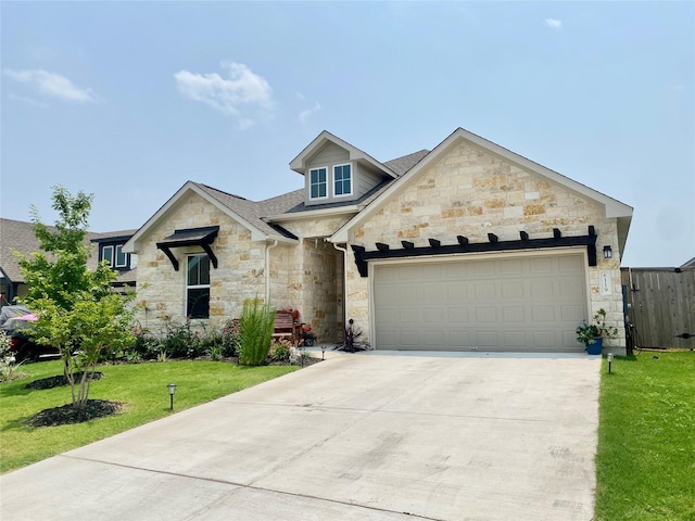 view of front of house with a garage and a front yard