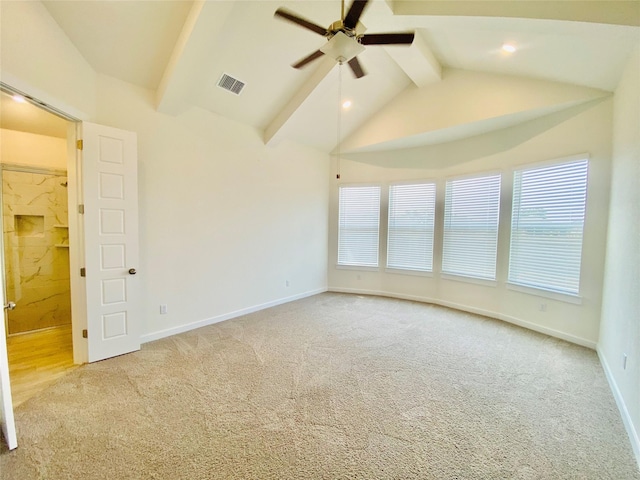 carpeted empty room with ceiling fan and vaulted ceiling with beams