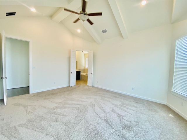 interior space with ceiling fan, vaulted ceiling with beams, and light colored carpet