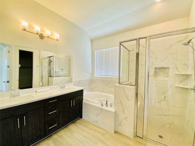 bathroom featuring vanity and plus walk in shower