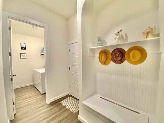 mudroom with washer and dryer and hardwood / wood-style flooring