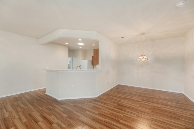 interior space with lofted ceiling with beams and light wood-type flooring