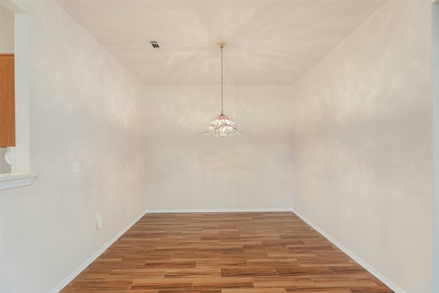 unfurnished dining area with hardwood / wood-style floors