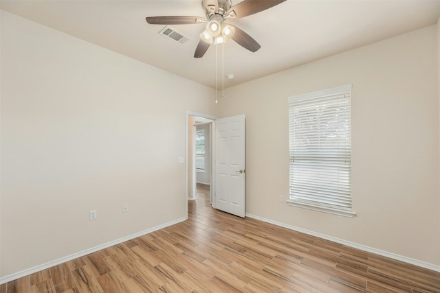 unfurnished room with ceiling fan and light hardwood / wood-style flooring