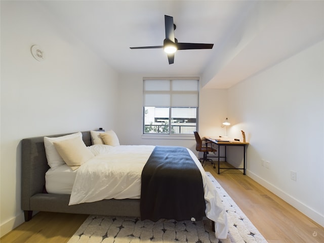 bedroom featuring ceiling fan and hardwood / wood-style flooring