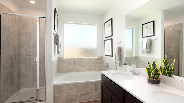 bathroom featuring separate shower and tub and vanity