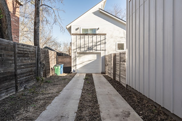 view of side of property featuring a garage