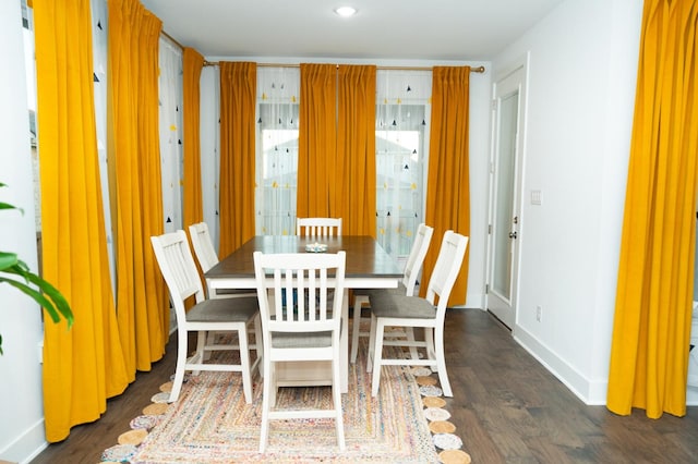 dining area featuring dark hardwood / wood-style floors