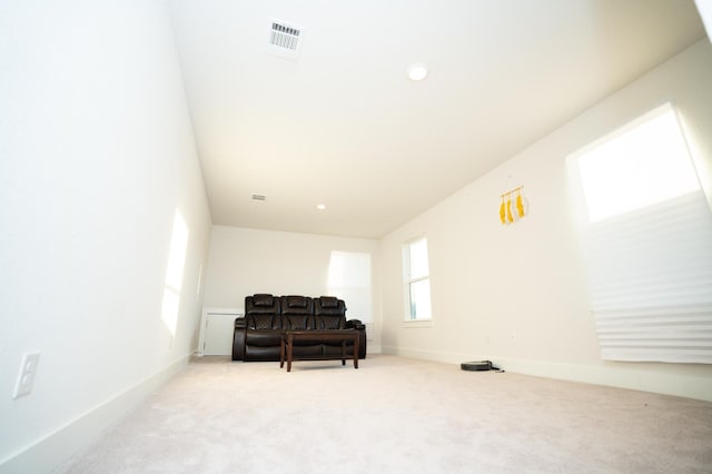 living area with light colored carpet