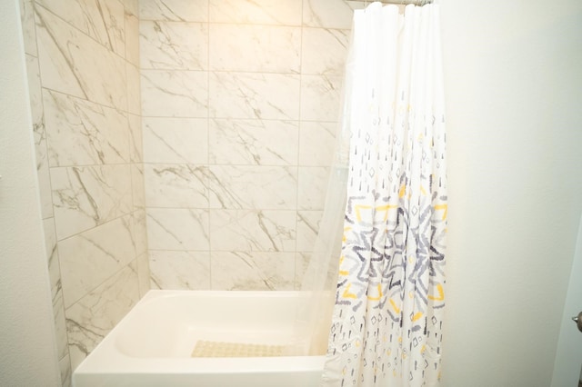 bathroom featuring shower / bath combination with curtain