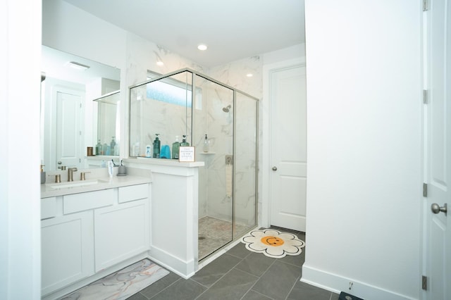 bathroom featuring an enclosed shower and vanity