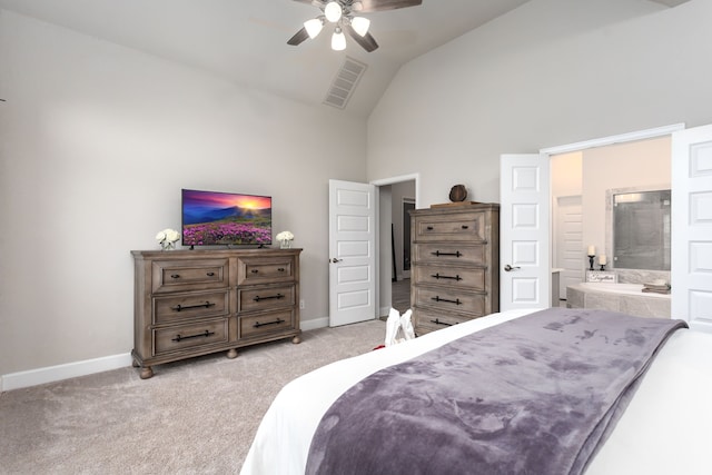 carpeted bedroom featuring ceiling fan, high vaulted ceiling, and ensuite bath