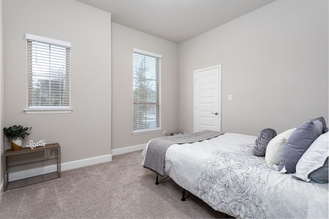 bedroom featuring light carpet