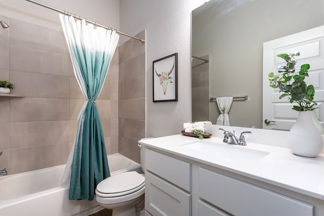 full bathroom featuring toilet, vanity, and shower / tub combo