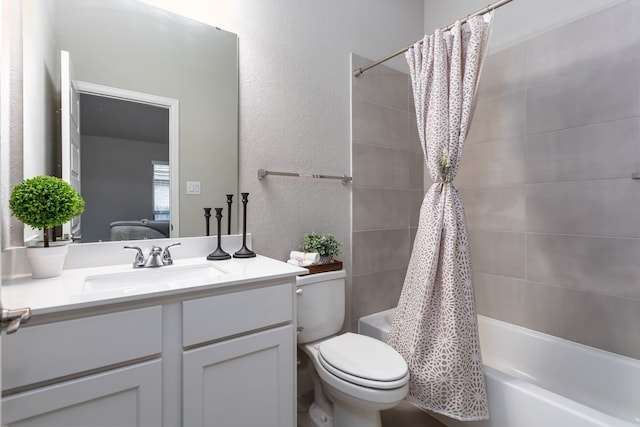 full bathroom featuring toilet, vanity, and shower / tub combo