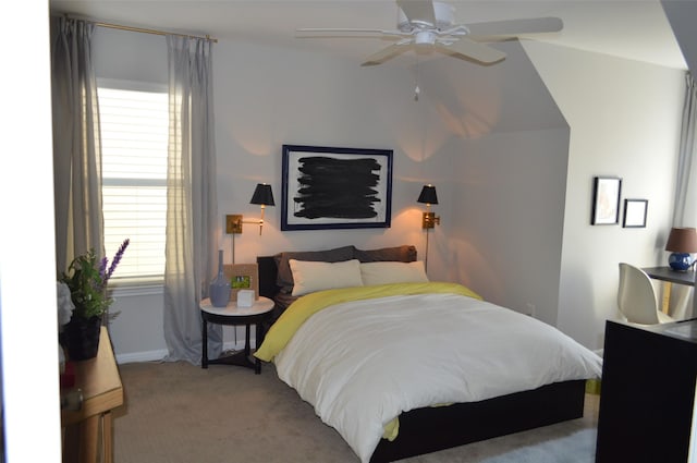 bedroom featuring ceiling fan and light colored carpet