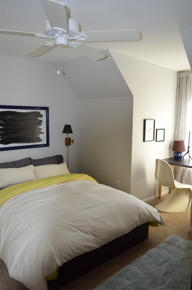 bedroom featuring vaulted ceiling, ceiling fan, and carpet flooring