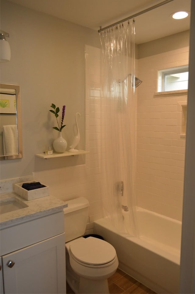 full bathroom featuring toilet, shower / bath combo, wood-type flooring, and vanity