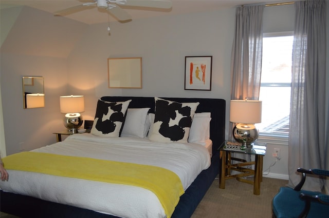 bedroom with ceiling fan, carpet flooring, and lofted ceiling