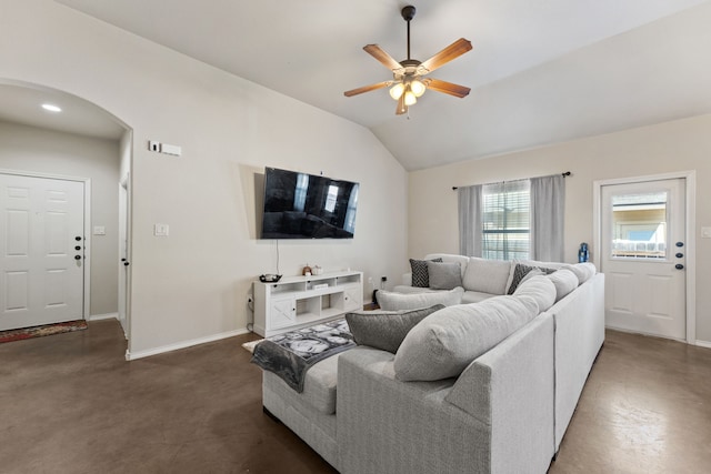 living room with ceiling fan and vaulted ceiling