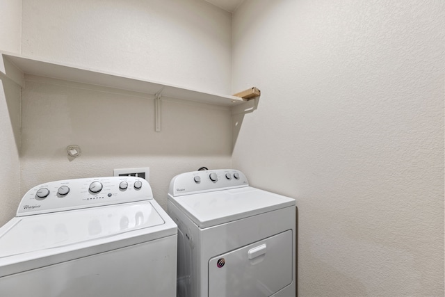 laundry room with washer and clothes dryer