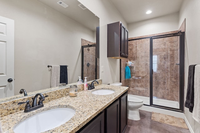 bathroom featuring toilet, walk in shower, and vanity