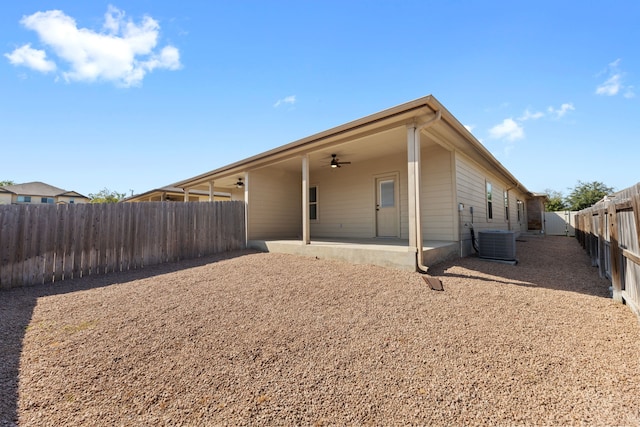 rear view of property with ceiling fan, central AC unit, and a patio