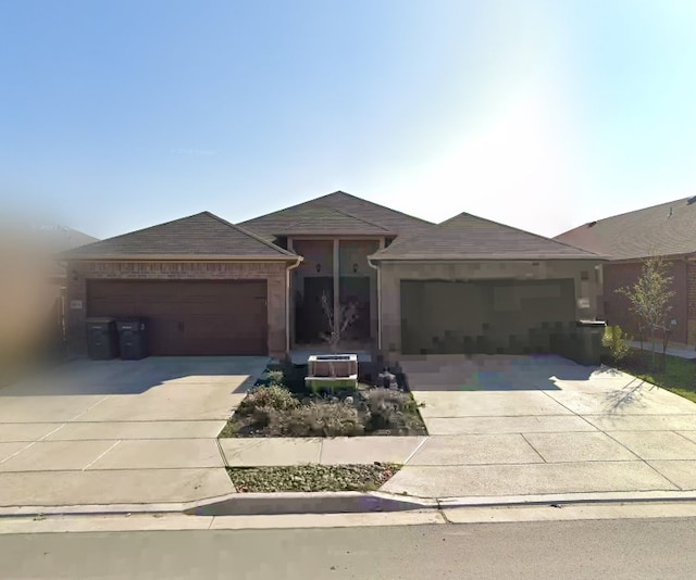 single story home featuring a garage