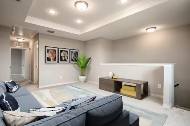 living room with crown molding, light carpet, and a raised ceiling