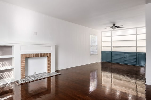 unfurnished living room featuring ceiling fan and built in shelves