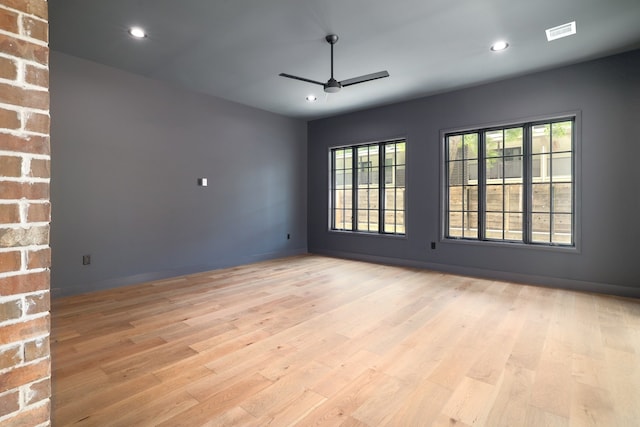 unfurnished room featuring ceiling fan and light hardwood / wood-style flooring