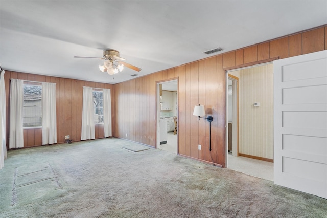 carpeted empty room with ceiling fan