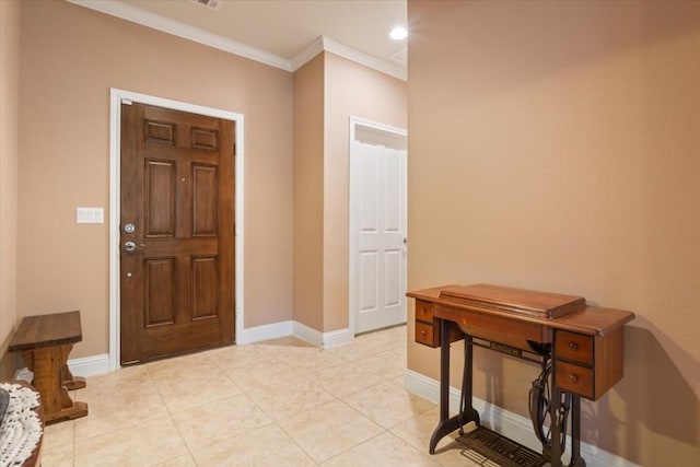 foyer with crown molding, baseboards, and light tile patterned floors