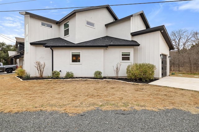 view of home's exterior featuring a garage and a lawn