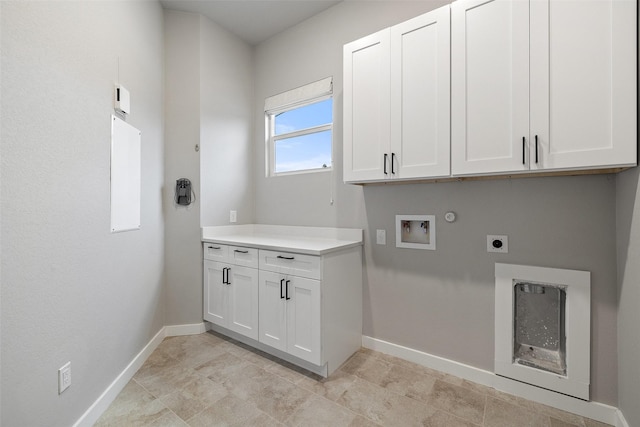 clothes washing area with washer hookup, cabinets, hookup for an electric dryer, and hookup for a gas dryer