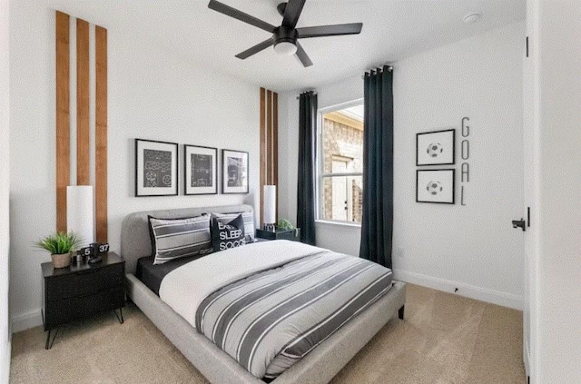 carpeted bedroom featuring ceiling fan