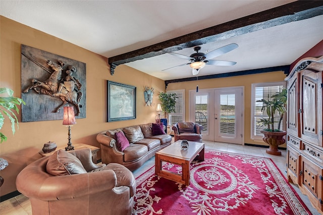 tiled living room featuring ceiling fan, beam ceiling, and french doors