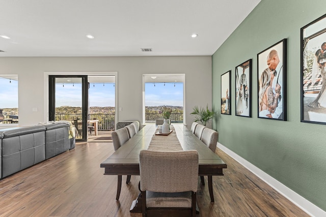 dining area with dark wood-type flooring