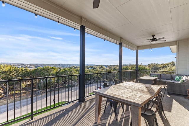 wooden deck with ceiling fan and an outdoor hangout area