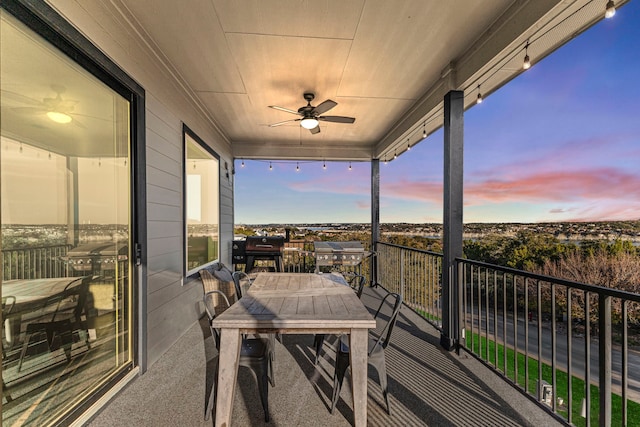 balcony at dusk with ceiling fan