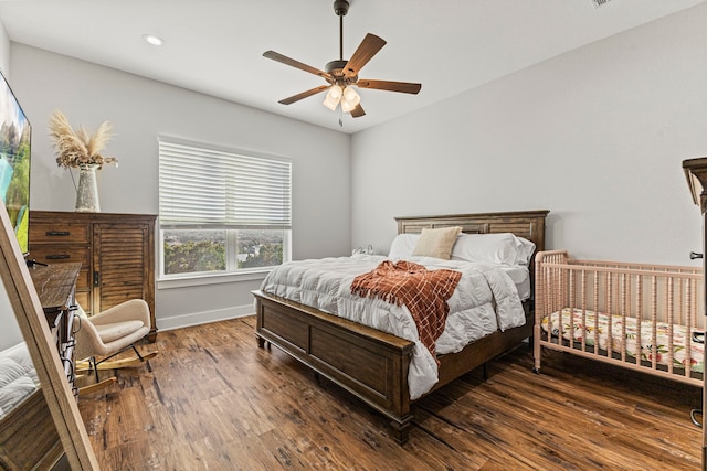 bedroom featuring ceiling fan and dark hardwood / wood-style flooring